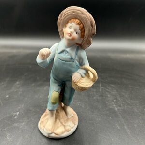Charming Porcelain Boy Figurine in Blue Overalls barefoot carrying basket